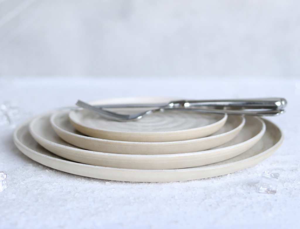 Stack of Pepper White ceramic plates
